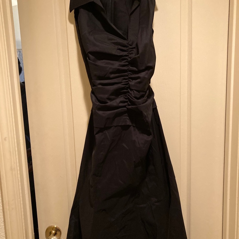 Black sleeveless dress with gathering at the waist